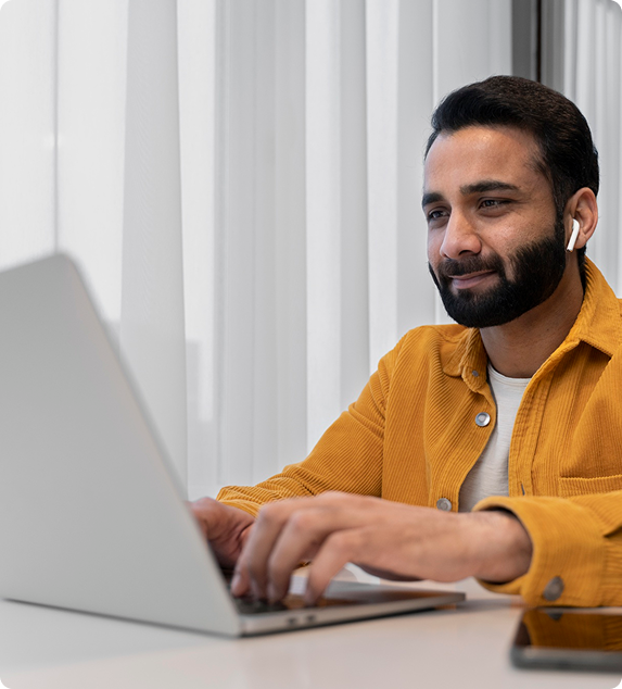Digital marketing professional managing retail media campaigns on laptop remotely